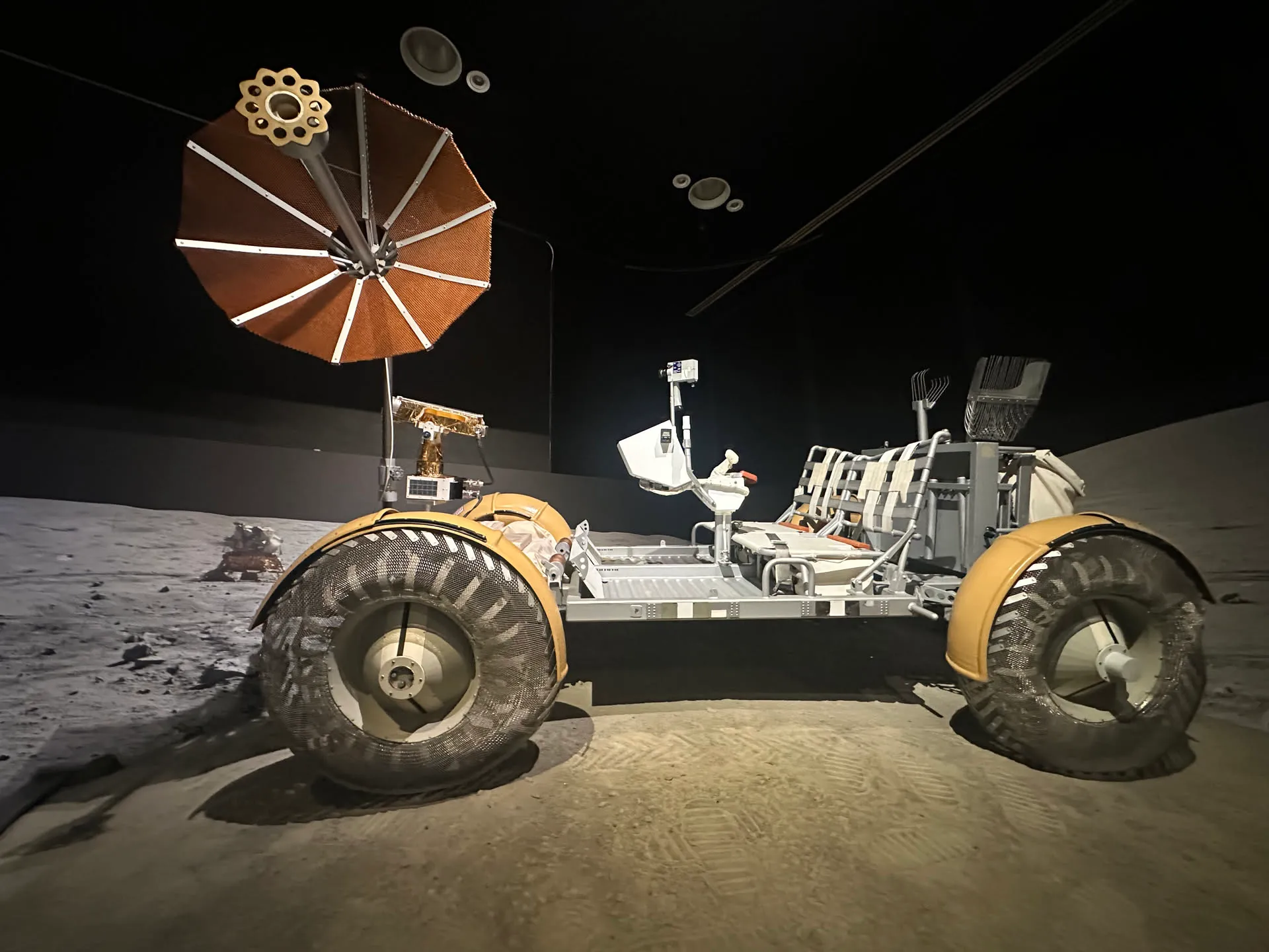 The Apollo lunar rover in a darkened gallery at the Museum of Flight
