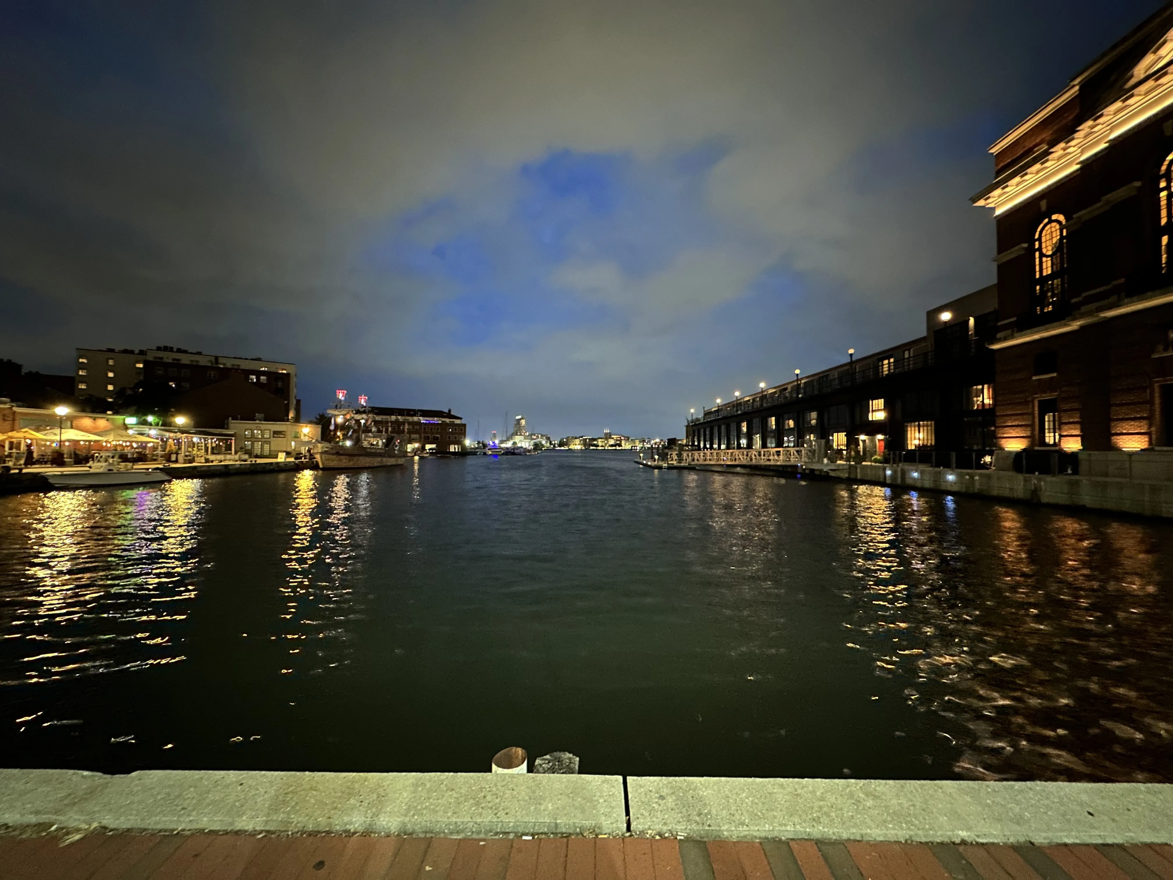 Inner Harbor at night, water reflecting the city lights