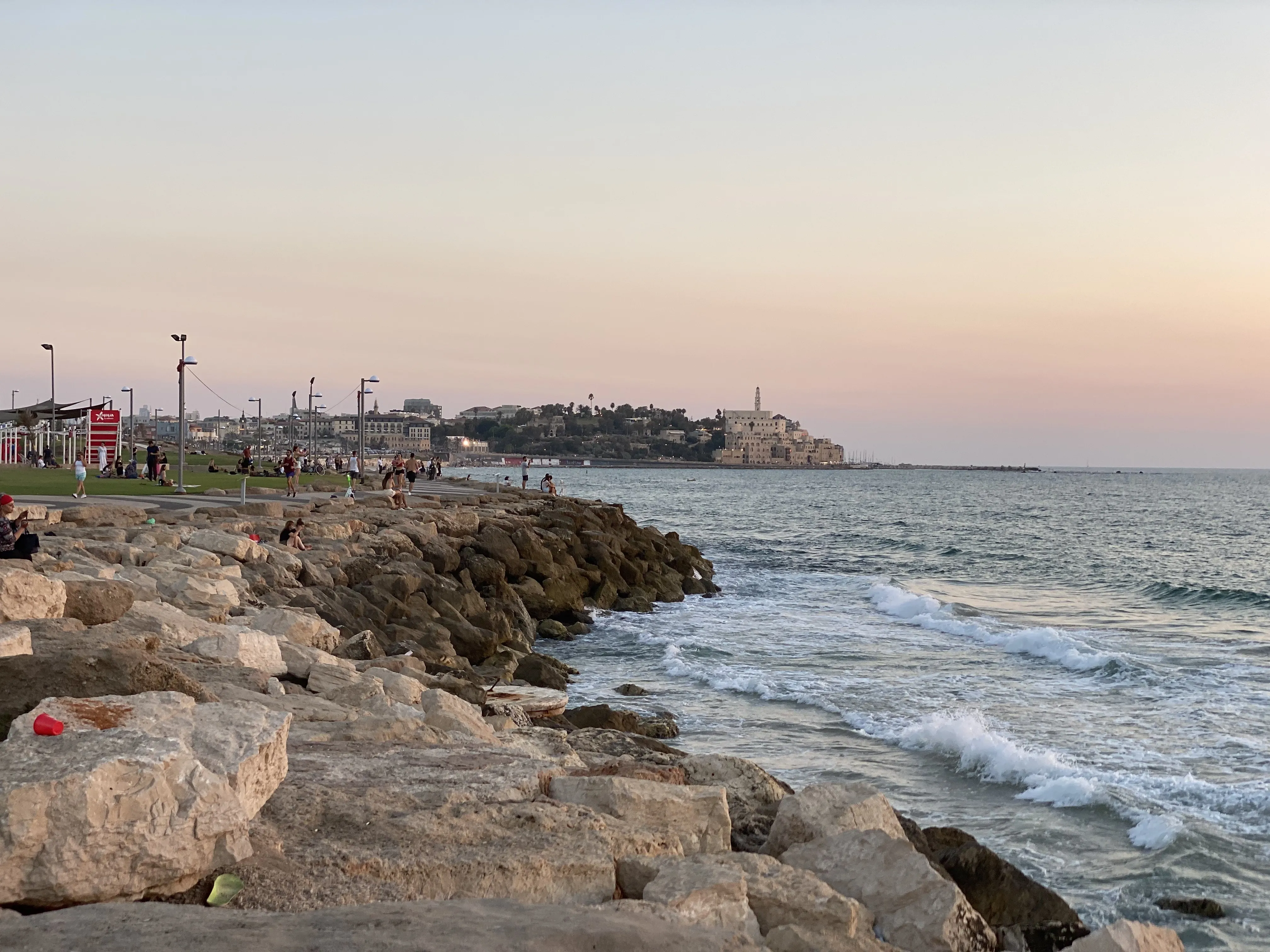Old Jaffa coastline at dusk, looking toward the rocks and surf